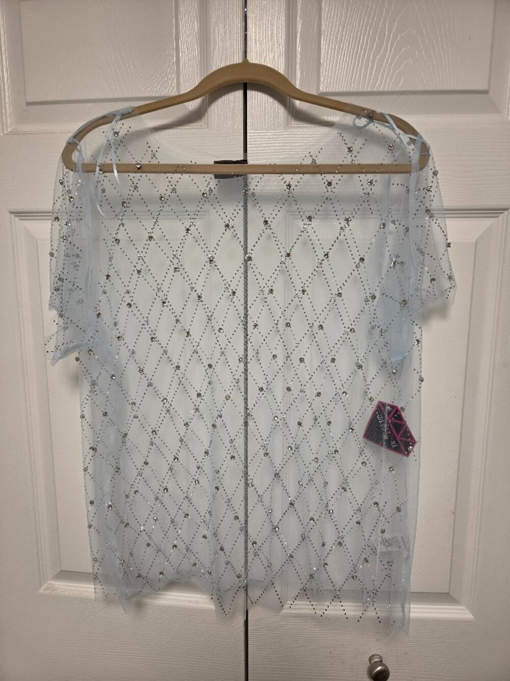 Sky-blue top with rhinestones.New